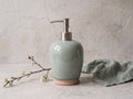 Celadon crackle-glaze ceramic soap dispenser with brushed stainless steel pump and terracotta foot
