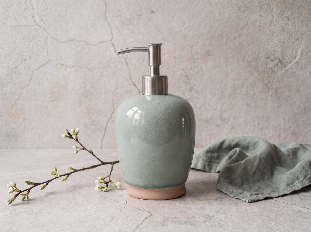 Celadon crackle-glaze ceramic soap dispenser with brushed stainless steel pump and terracotta foot