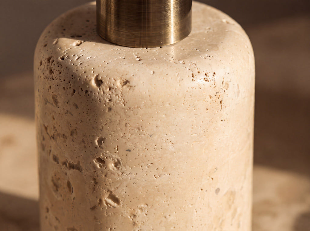 Macro close-up of natural unpolished travertine showing open pores, pits and soft horizontal veining
