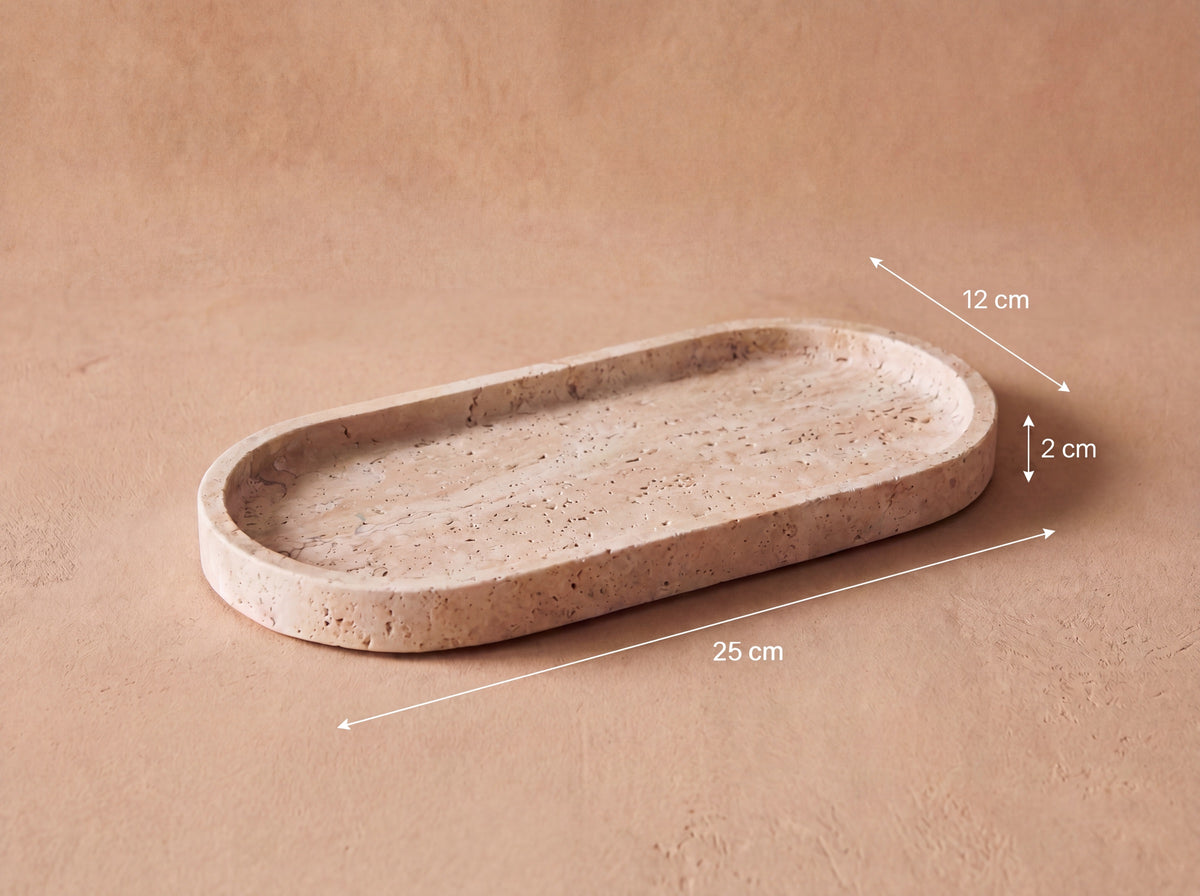 Oval travertine tray with measurement labels reading 25 cm long, 12 cm wide and 2 cm high.