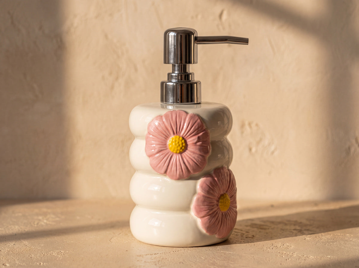 Close up of the chrome pump and long spout on the top ring of the white porcelain dispenser.