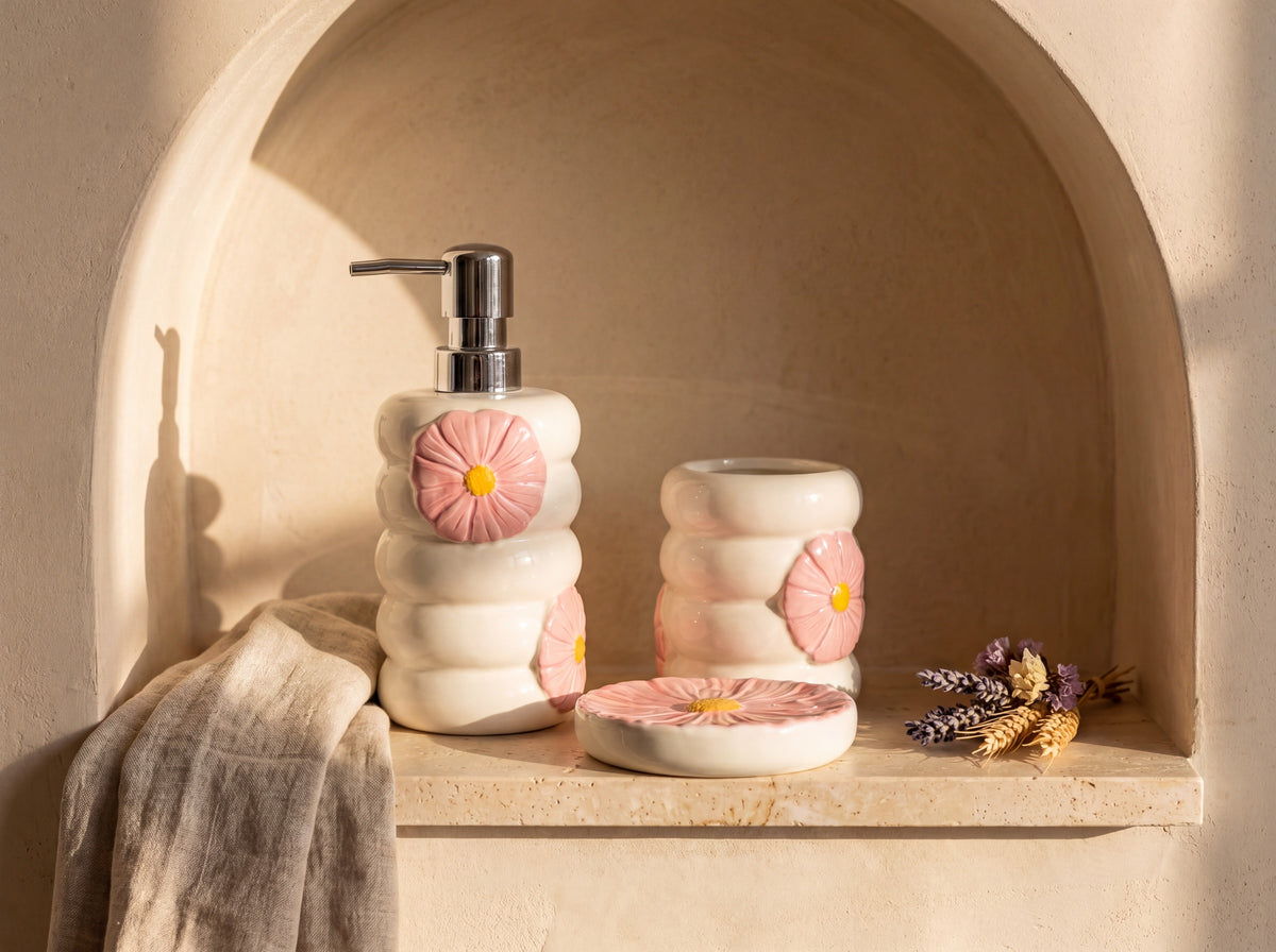 Porcelain flower bathroom set styled in an arched plaster wall niche with linen and dried flowers.