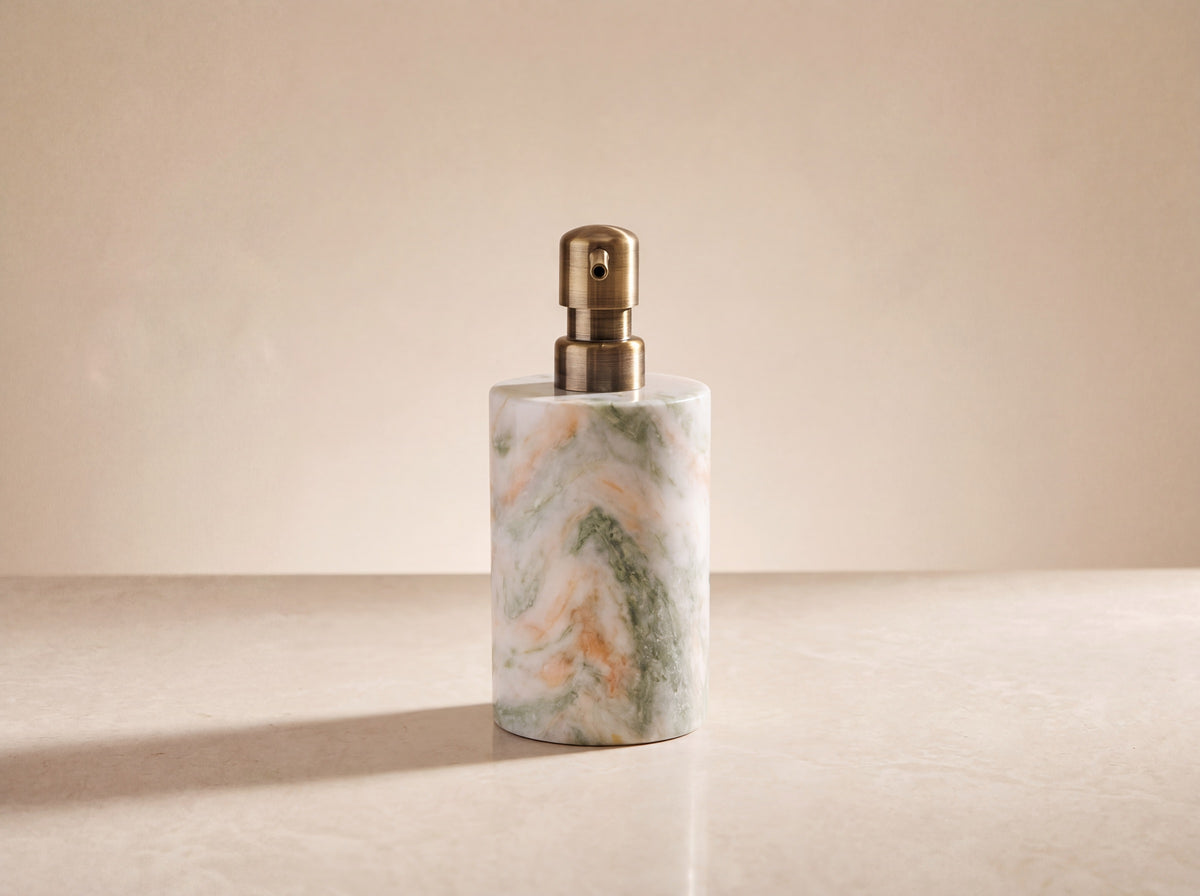 Back view of the marble soap dispenser showing the full drift of sage green and peach veining